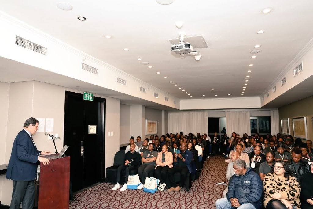 Large capacity building workshop with participants seated in rows